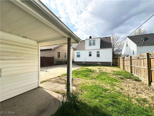 View of yard with fence and a patio | Image 16