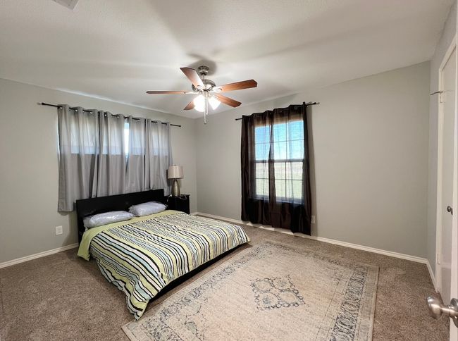 Bedroom featuring carpet flooring and a ceiling fan | Image 6
