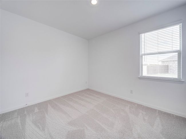 Unfurnished room with light colored carpet and baseboards | Image 24