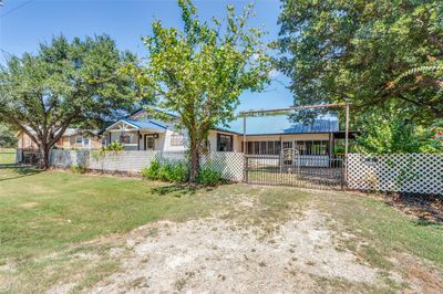 Right front view of house with gate | Image 2