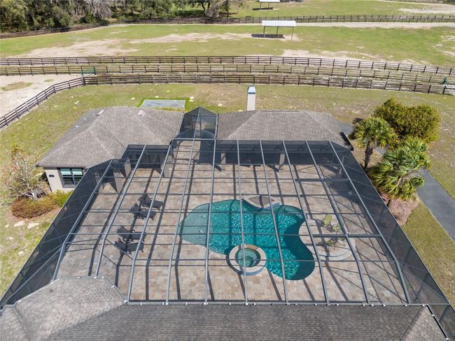 Overhead of pool area entirely screened in for protection from bugs, etc | Image 67