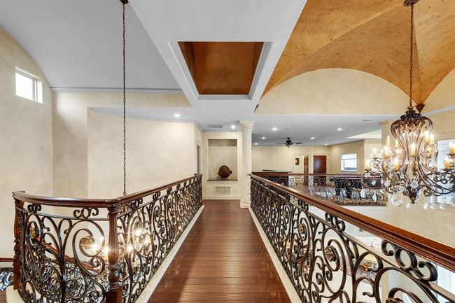 view from top of staircase leading to game room | Image 32