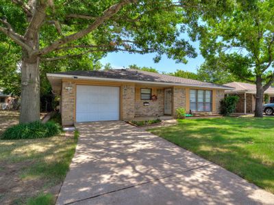 Ranch-style brick home with nice landscaping and mature trees! | Image 2