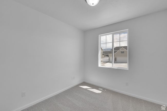 Carpeted spare room featuring baseboards | Image 13