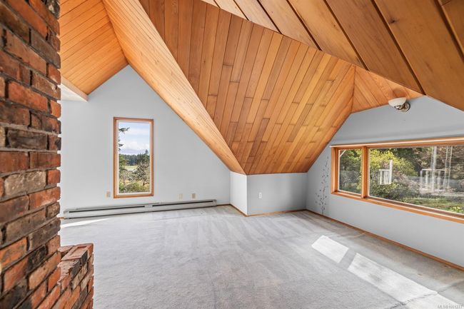 Additional living space with baseboard heating, vaulted ceiling, carpet flooring, and wooden ceiling | Image 22