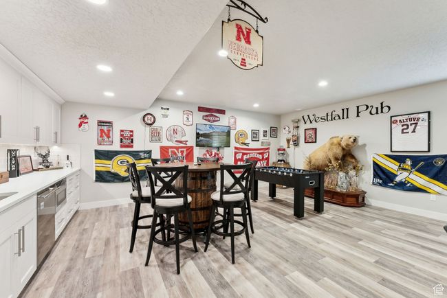 Dining space featuring a textured ceiling, light wood-style floors, recessed lighting, and baseboards | Image 31