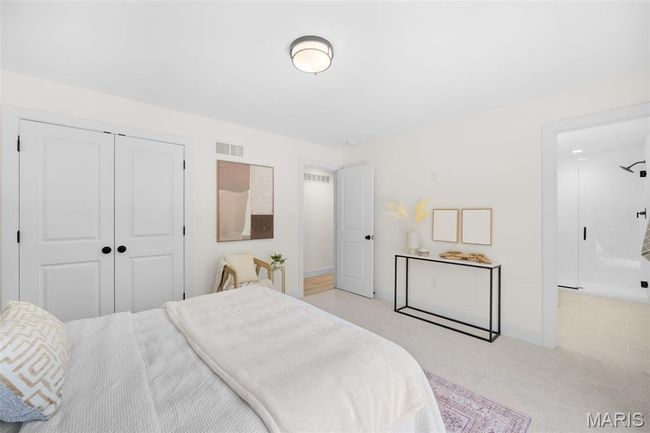 Bedroom featuring light colored carpet and a closet | Image 26