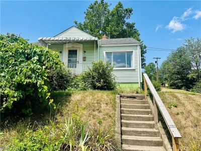 View of bungalow-style house | Image 1