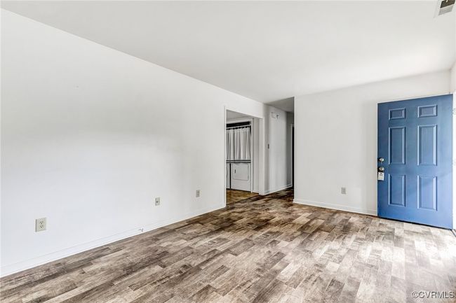 Empty room with wood finished floors and baseboards | Image 10