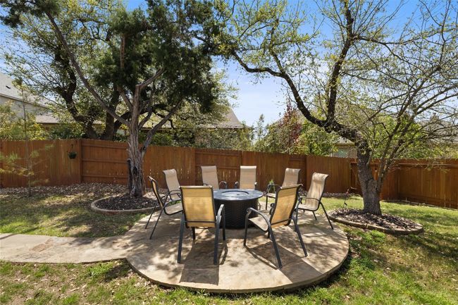 Flagstone patio with firepit area sets the stage for cozy Hill Country evenings | Image 26