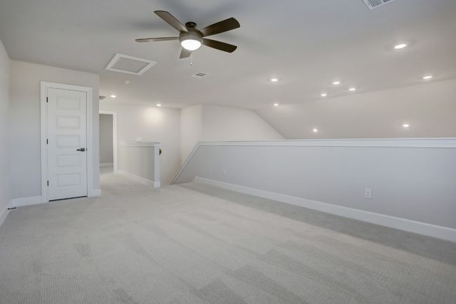 An upstairs game room provides the perfect opportunity for your kids and their friends to hangout and have sleepovers in their own space. | Image 9