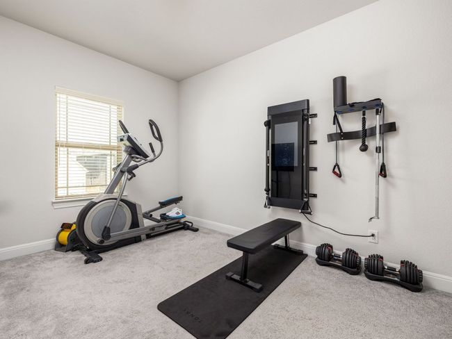Exercise room with baseboards and carpet floors | Image 18