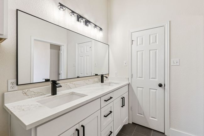Bathroom featuring double vanity and tile patterned flooring | Image 19
