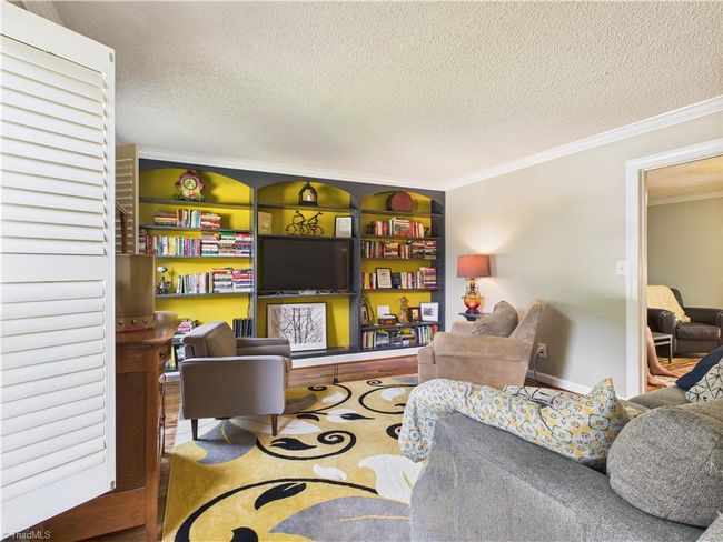 Lots of natural light in the living room with great built ins. | Image 4