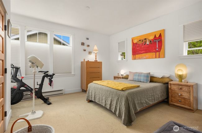 The spacious primary suite with giant walk-in closet and light pouring in from the west and north. | Image 16