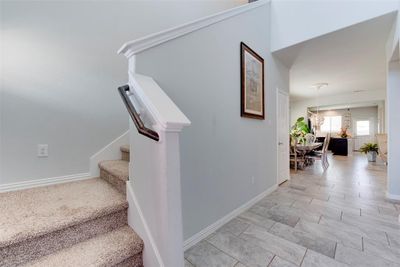 Welcoming entryway wiht high ceilings and plenty of natural light. | Image 3