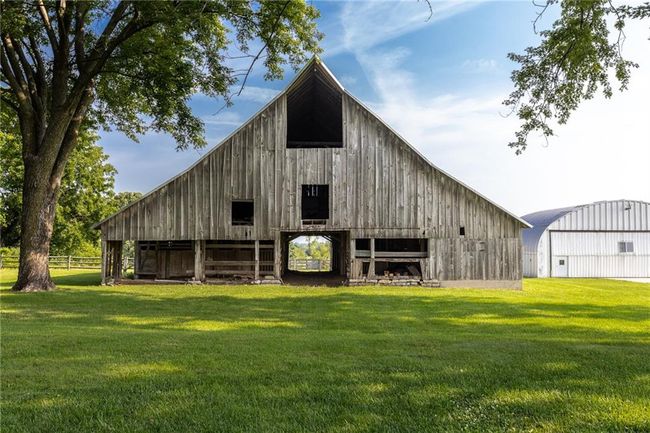 View of outdoor structure with a yard | Image 31