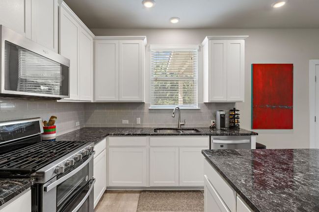 Kitchen w/ White Shaker Cabinets, Granite Counter Top & SS Appliances | Image 9