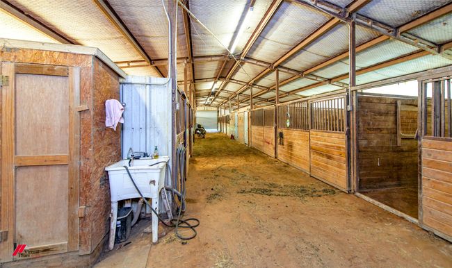 Wash Bay with sink, (water heater in closet), concrete floor. | Image 10