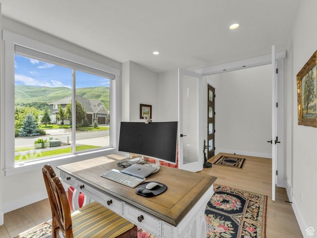 Office area with light wood-style flooring, recessed lighting, and baseboards | Image 7