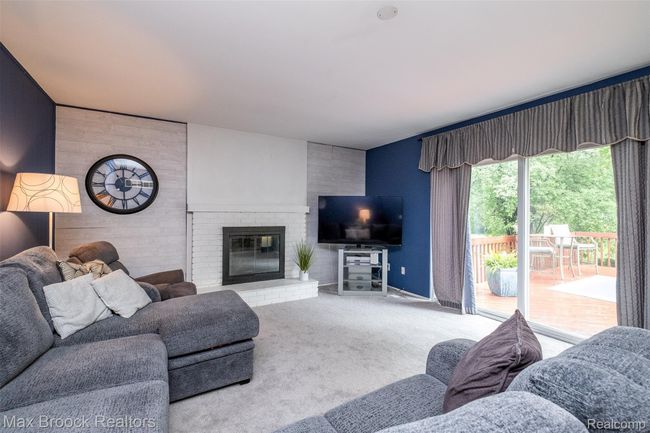 Family Room over looks large deck and beautiful private private lot | Image 14