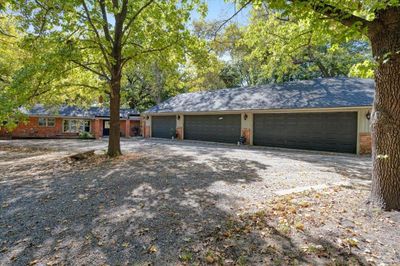 View of front facade featuring a garage | Image 2