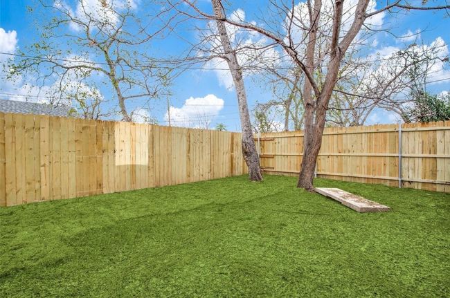 View of yard with a fenced backyard | Image 6