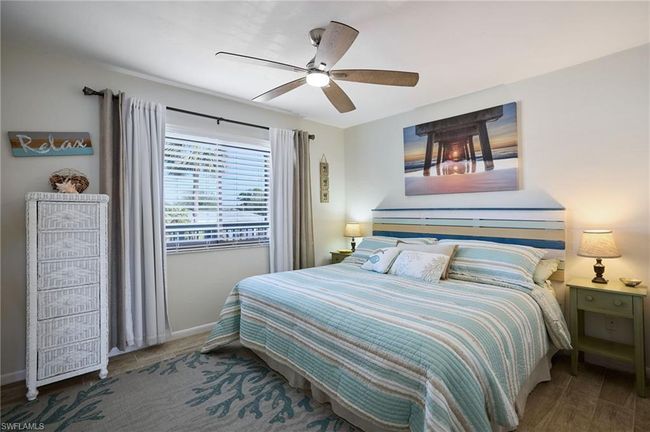 Bedroom featuring tile flooring and ceiling fan | Image 11