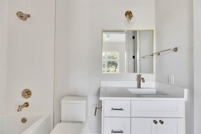 Full bathroom with vanity, toilet, and bathtub / shower combination | Image 15
