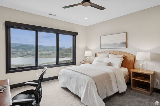 Bedroom featuring carpet flooring, ceiling fan, recessed lighting, and a mountain view | Image 50