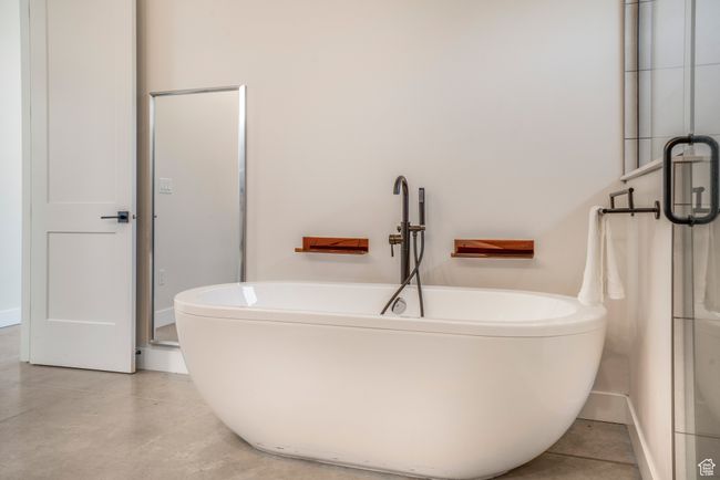Full bathroom with concrete floors, baseboards, and a soaking tub | Image 29
