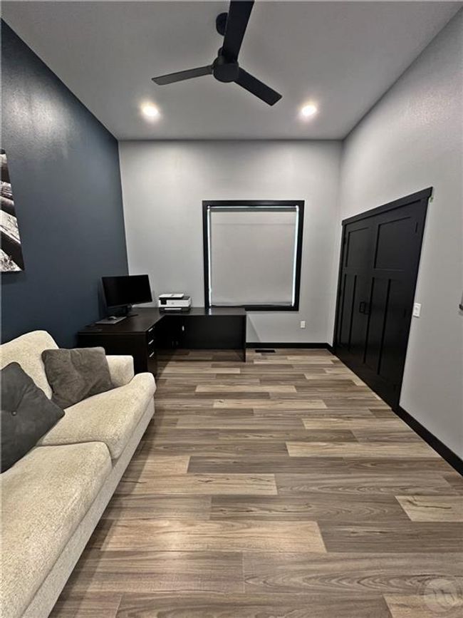 Bedroom #2. Only bedroom with 11' ceilings. Modern barn doors with a roller shade on the inside for privacy when needed | Image 30