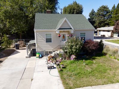 Bungalow-style house with a front lawn | Image 1