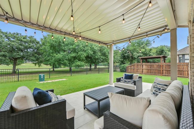 Fenced backyard featuring an outdoor hangout area and a patio | Image 30