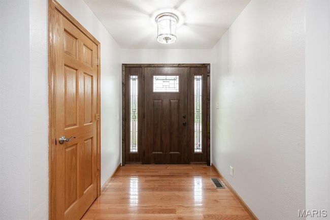 Entryway featuring light wood-style flooring and baseboards | Image 10