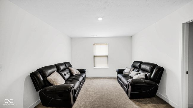 carpeted living room featuring baseboards | Image 22