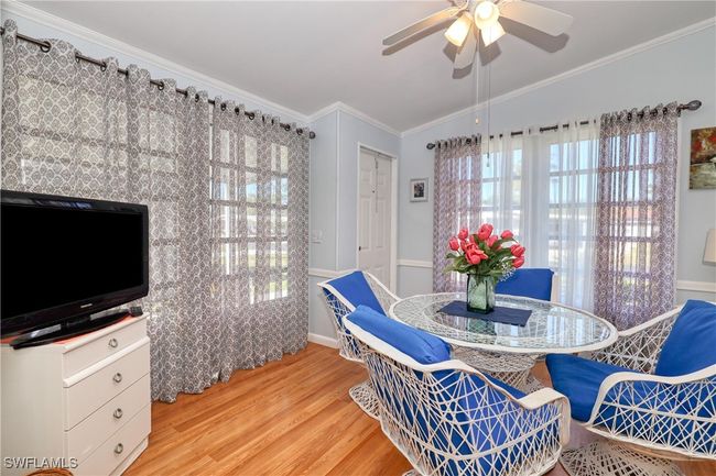 Dining area featuring ceiling fan, crown molding, and light hardwood / wood-style flooring | Image 22