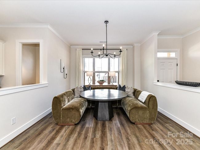 Spacious Dining Area with custom light fixture, plenty of natural light & LVP floors! | Image 10