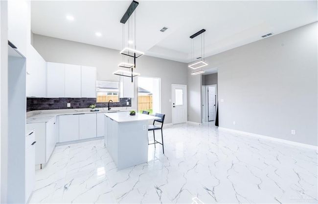 Open concept kitchen, dining and living area | Image 6