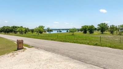 View of front of home with a front lawn and a patio | Image 2