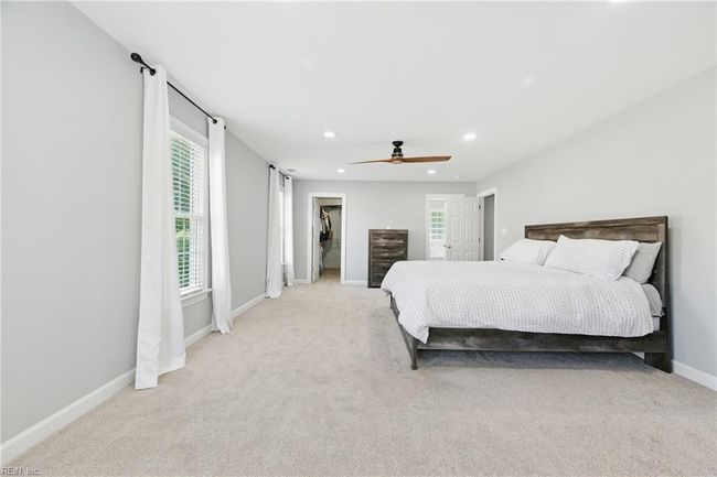 Alternate view of the Primary Suite looking towards the walk-in closet and Primary Bathroom... | Image 19