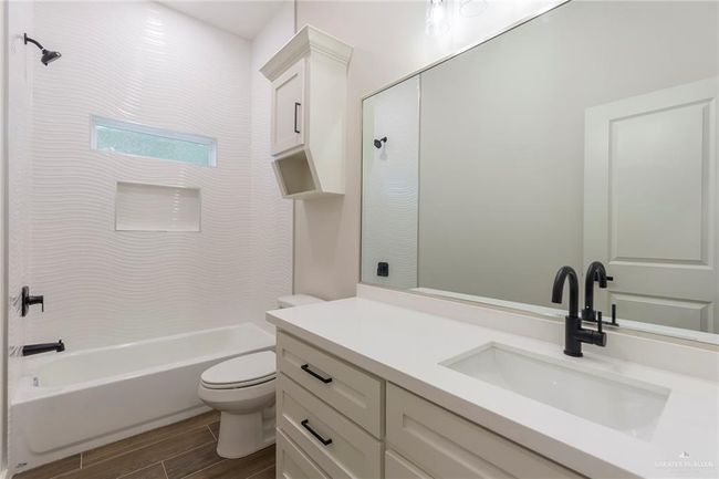 Full bathroom with vanity, shower / bathtub combination, and toilet | Image 24