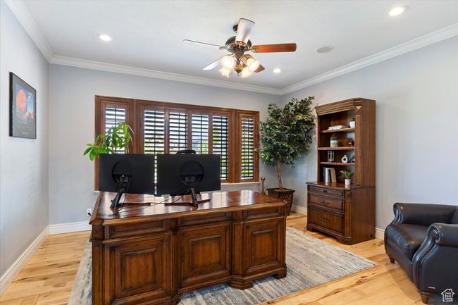 Office featuring ceiling fan, baseboards, ornamental molding, recessed lighting, and light wood-style flooring | Image 28
