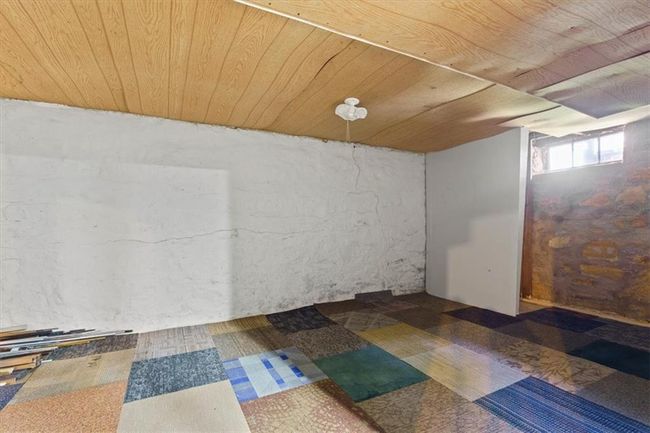 Below grade area featuring wooden ceiling | Image 23