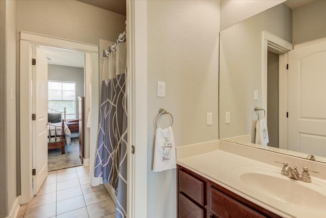 Full bath with a shower, tile patterned flooring, and vanity | Image 31