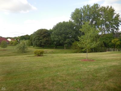 Side view of Yard of Property 5318 Caring Cove | Image 3