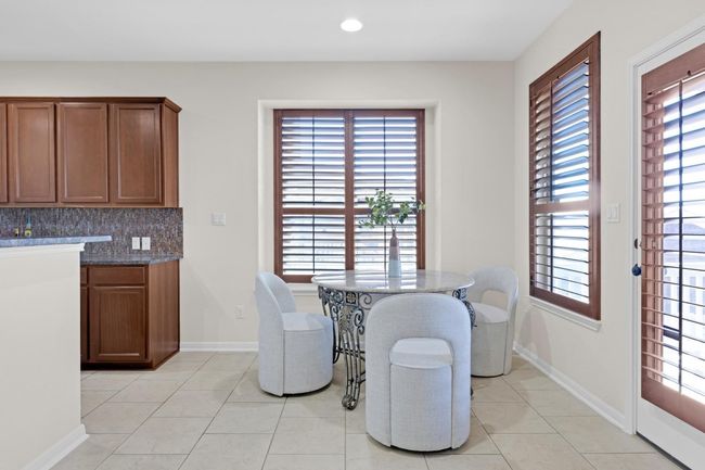 Dining space with natural lighting and tile flooring | Image 10