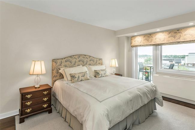 Bedroom with access to exterior, light wood-style flooring, baseboards, and recessed lighting | Image 11