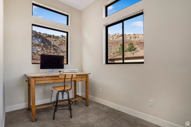 Office area with concrete floors and baseboards | Image 24