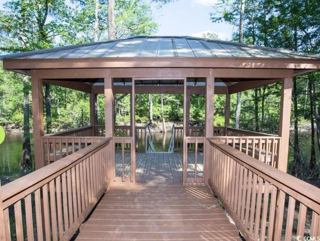 View of dock featuring a gazebo and a deck with water view | Image 40